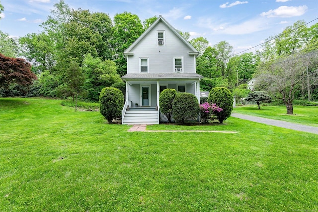 5 New Street Ext, Wilton, CT 06897 - view of front of home featuring covered porch and a front lawn