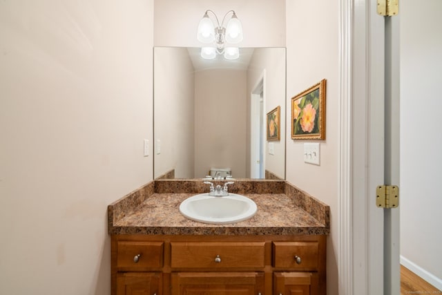 half bath featuring vanity