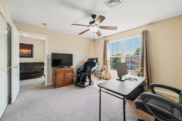 office space featuring ceiling fan, carpet, and baseboards