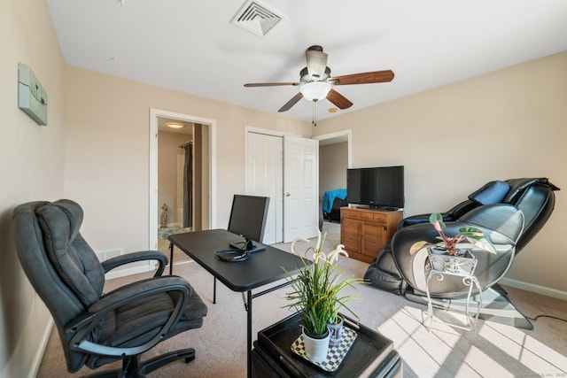 office featuring carpet flooring, baseboards, and a ceiling fan
