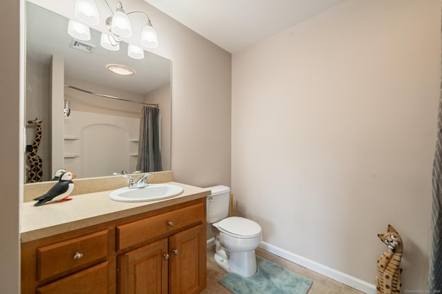 bathroom with toilet, vanity, tile patterned floors, baseboards, and curtained shower