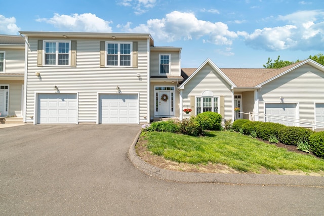 view of front of property with driveway and a garage