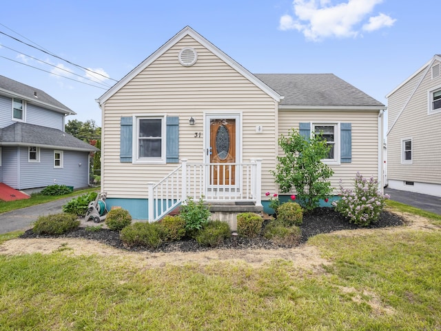 31 Emerson St, Norwalk, CT 06855 - view of front facade with a front yard
