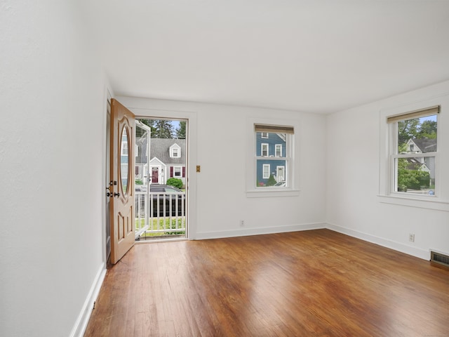 31 Emerson St, Norwalk, CT 06855 - entrance foyer with wood finished floors and baseboards