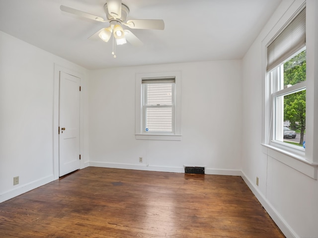 31 Emerson St, Norwalk, CT 06855 - empty room featuring healthy amount of natural light, dark wood-style floors, and ceiling fan