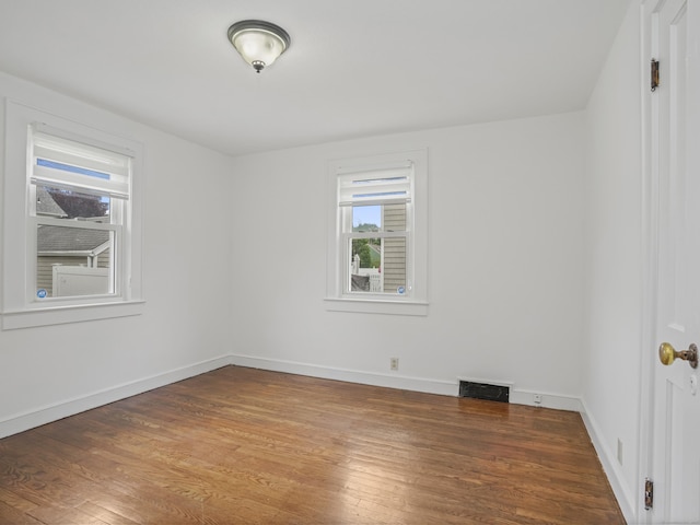 31 Emerson St, Norwalk, CT 06855 - spare room featuring plenty of natural light, wood finished floors, and baseboards