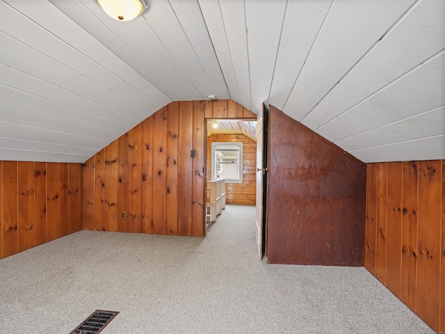 31 Emerson St, Norwalk, CT 06855 - bonus room with wood walls, carpet, and vaulted ceiling