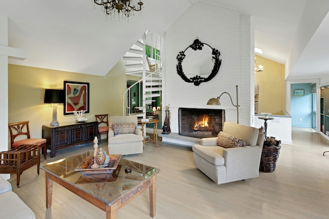 32 Beeholm Rd, Redding, CT 06896 - living area featuring a chandelier, wood finished floors, stairs, a fireplace, and high vaulted ceiling