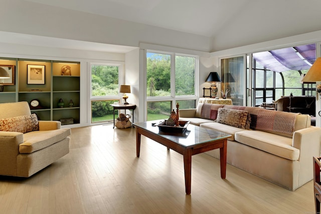 32 Beeholm Rd, Redding, CT 06896 - living room with vaulted ceiling and light wood-style flooring