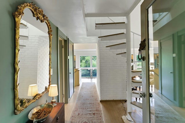 32 Beeholm Rd, Redding, CT 06896 - hall featuring light wood-type flooring and brick wall