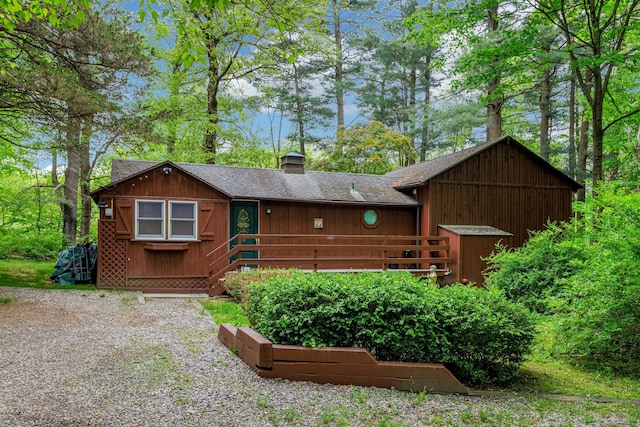 32 Beeholm Rd, Redding, CT 06896 - chalet / cabin featuring a chimney, roof with shingles, and a deck