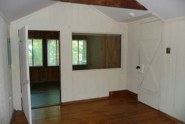 32 Beeholm Rd, Redding, CT 06896 - empty room with lofted ceiling, dark wood finished floors, wood walls, electric panel, and baseboards