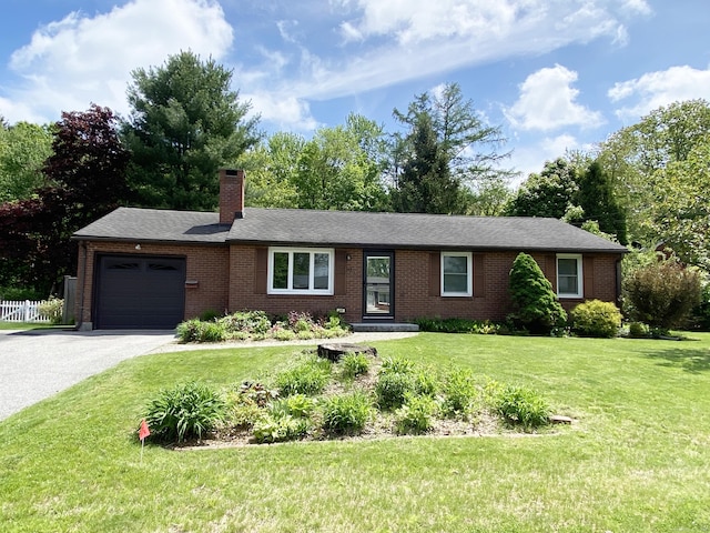 149 Edgewood Dr, Torrington, CT 06790 - ranch-style house featuring a garage, a chimney, brick siding, and asphalt driveway