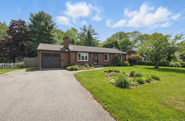 149 Edgewood Dr, Torrington, CT 06790 - ranch-style home featuring a garage, asphalt driveway, a chimney, and brick siding
