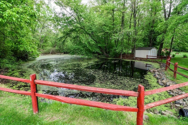 9 Rosick Rd, Wallingford, CT 06492 - view of yard featuring fence, a storage shed, an outbuilding, and a view of trees