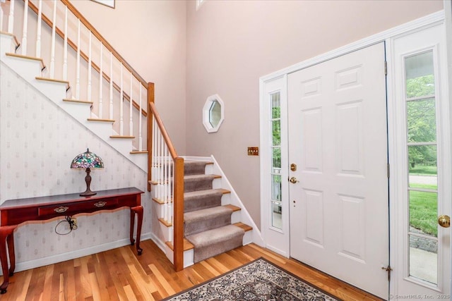 9 Rosick Rd, Wallingford, CT 06492 - entryway with wood finished floors, baseboards, stairs, and wallpapered walls