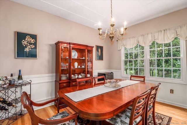 9 Rosick Rd, Wallingford, CT 06492 - dining room featuring wood finished floors, a chandelier, and a wainscoted wall