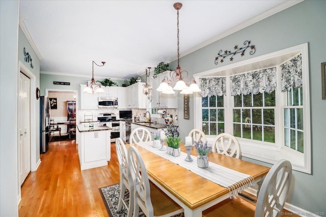 9 Rosick Rd, Wallingford, CT 06492 - dining room featuring a chandelier, crown molding, and light wood-type flooring