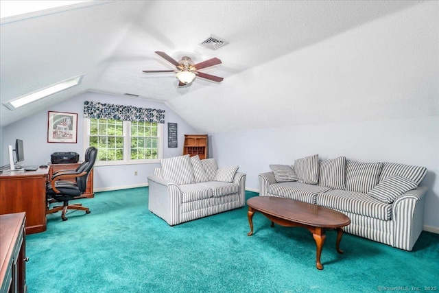 9 Rosick Rd, Wallingford, CT 06492 - living room with a desk, lofted ceiling, a skylight, carpet floors, and baseboards
