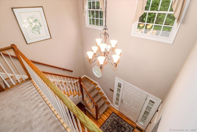 9 Rosick Rd, Wallingford, CT 06492 - stairs featuring a chandelier, healthy amount of natural light, and a high ceiling