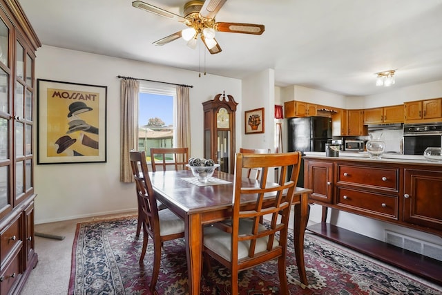 90 Russell Rd, Stratford, CT 06614 - dining area featuring ceiling fan, baseboards, and light colored carpet