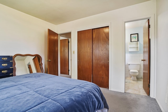 90 Russell Rd, Stratford, CT 06614 - bedroom featuring carpet, a closet, ensuite bathroom, and tile walls