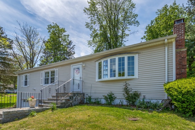 27 Lansing Ave, Trumbull, CT 06611 - ranch-style house with a front yard and a chimney