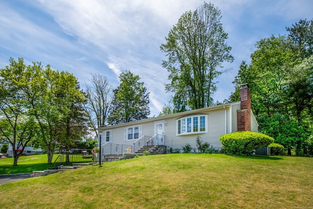 27 Lansing Ave, Trumbull, CT 06611 - view of front of house with a chimney and a front lawn