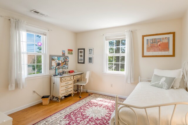 27 Lansing Ave, Trumbull, CT 06611 - bedroom with light wood-style floors, baseboards, and an office area