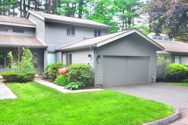5 Spyglass Dr Unit 5, Avon, CT 06001 - view of front of home with an attached garage, asphalt driveway, a front yard, and a shingled roof