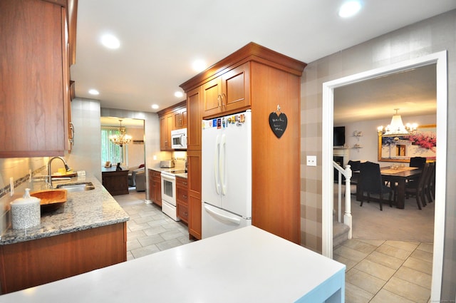 5 Spyglass Dr Unit 5, Avon, CT 06001 - kitchen with a chandelier, white appliances, a sink, brown cabinets, and recessed lighting