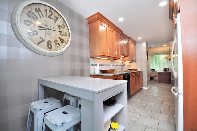 5 Spyglass Dr Unit 5, Avon, CT 06001 - kitchen featuring wallpapered walls, a sink, brown cabinets, freestanding refrigerator, and recessed lighting