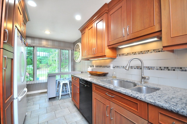 5 Spyglass Dr Unit 5, Avon, CT 06001 - kitchen with dishwasher, a sink, brown cabinets, decorative backsplash, and light tile patterned floors