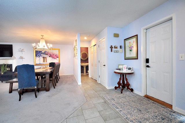 5 Spyglass Dr Unit 5, Avon, CT 06001 - dining room with a chandelier, baseboards, and tile patterned flooring