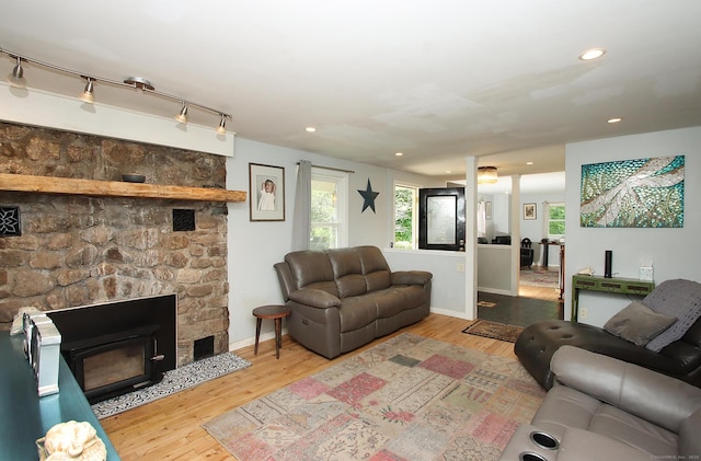113 Codfish Hill Rd, Bethel, CT 06801 - living room with wood finished floors, recessed lighting, a stone fireplace, and baseboards