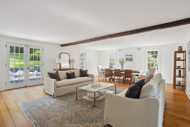 336 Old Branchville Rd, Ridgefield, CT 06877 - living area with light wood finished floors, french doors, and beamed ceiling