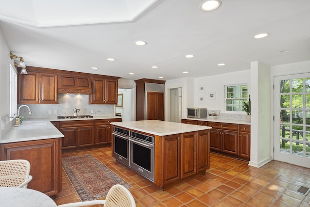 336 Old Branchville Rd, Ridgefield, CT 06877 - kitchen with a sink, stainless steel appliances, tasteful backsplash, recessed lighting, and a center island