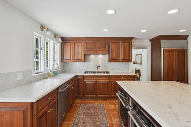 336 Old Branchville Rd, Ridgefield, CT 06877 - kitchen with a sink, appliances with stainless steel finishes, backsplash, recessed lighting, and light stone countertops