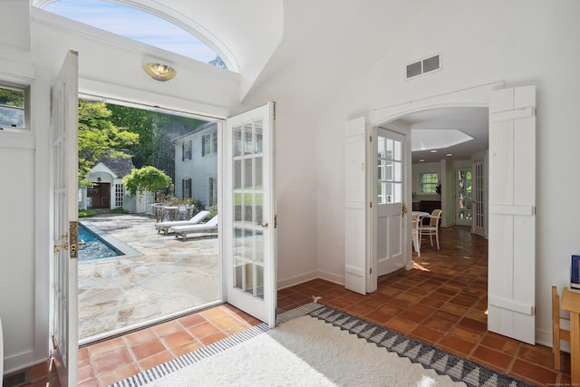 336 Old Branchville Rd, Ridgefield, CT 06877 - doorway featuring french doors, arched walkways, tile patterned floors, and vaulted ceiling
