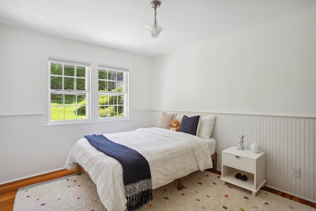 336 Old Branchville Rd, Ridgefield, CT 06877 - bedroom featuring a wainscoted wall and wood finished floors