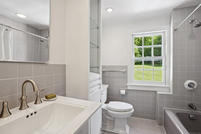 336 Old Branchville Rd, Ridgefield, CT 06877 - full bath with tile walls, tile patterned floors, shower / bath combo with shower curtain, toilet, and vanity
