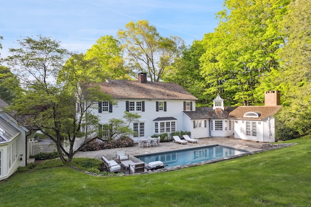 336 Old Branchville Rd, Ridgefield, CT 06877 - back of house featuring french doors, a chimney, a patio, an outdoor pool, and an outbuilding