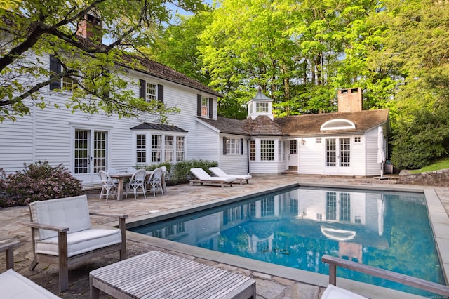 336 Old Branchville Rd, Ridgefield, CT 06877 - swimming pool with french doors, a storage structure, a patio area, an outbuilding, and an outdoor living space
