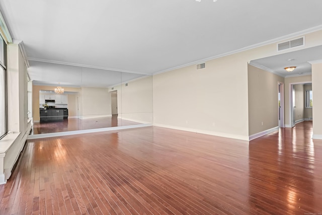 3200 Park Ave Unit 10A2, Bridgeport, CT 06604 - unfurnished living room featuring wood-type flooring, a chandelier, ornamental molding, and baseboards