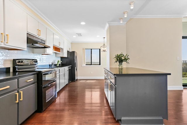 3200 Park Ave Unit 10A2, Bridgeport, CT 06604 - kitchen with double oven range, under cabinet range hood, dark countertops, baseboards, and crown molding