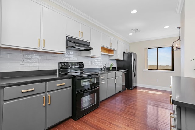 3200 Park Ave Unit 10A2, Bridgeport, CT 06604 - kitchen featuring under cabinet range hood, stainless steel appliances, dark countertops, baseboards, and ornamental molding
