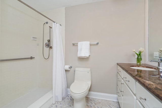 3200 Park Ave Unit 10A2, Bridgeport, CT 06604 - bathroom with vanity, a tile shower, toilet, and tile patterned floors