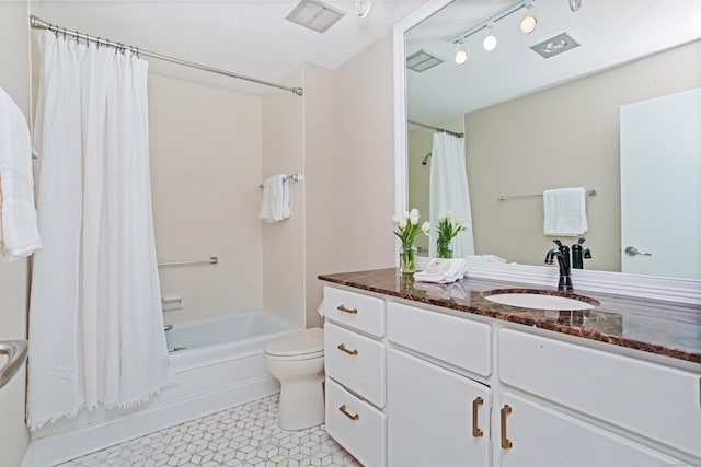 3200 Park Ave Unit 10A2, Bridgeport, CT 06604 - full bathroom featuring toilet, shower / tub combo, vanity, tile patterned flooring, and track lighting