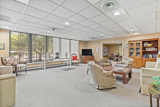 3200 Park Ave Unit 10A2, Bridgeport, CT 06604 - living room featuring carpet, a paneled ceiling, a baseboard heating unit, and a wall of windows