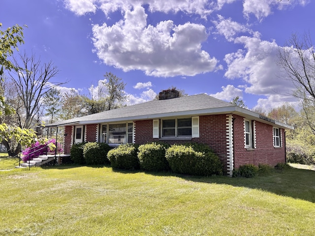 343 Lebanon Ave, Lebanon, CT 06249 - ranch-style home featuring brick siding, a front lawn, and a chimney